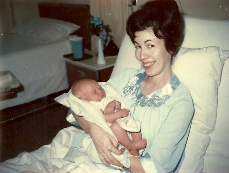 Mother Phyllis holding newborn son, Charles