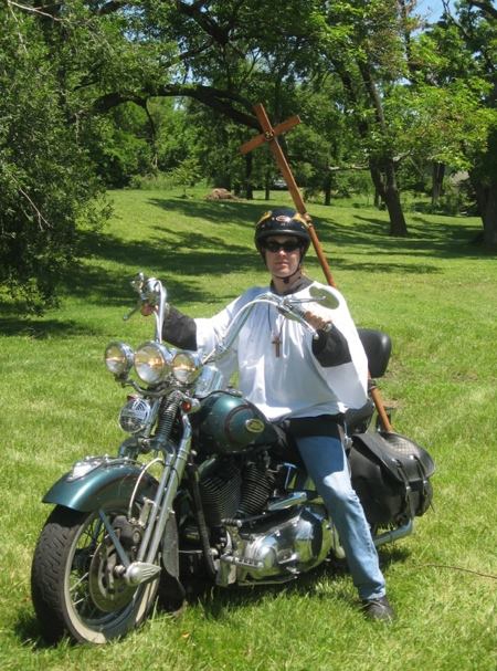  Young adult Charles M. Kester dressed for church baptism while riding his motorcycle