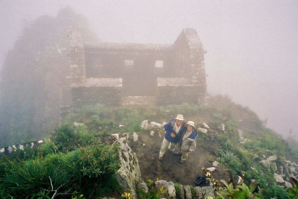 Monty and Phyllis Kester are seen standing in a foggy morning on top of Huayna Picchu in Peru.