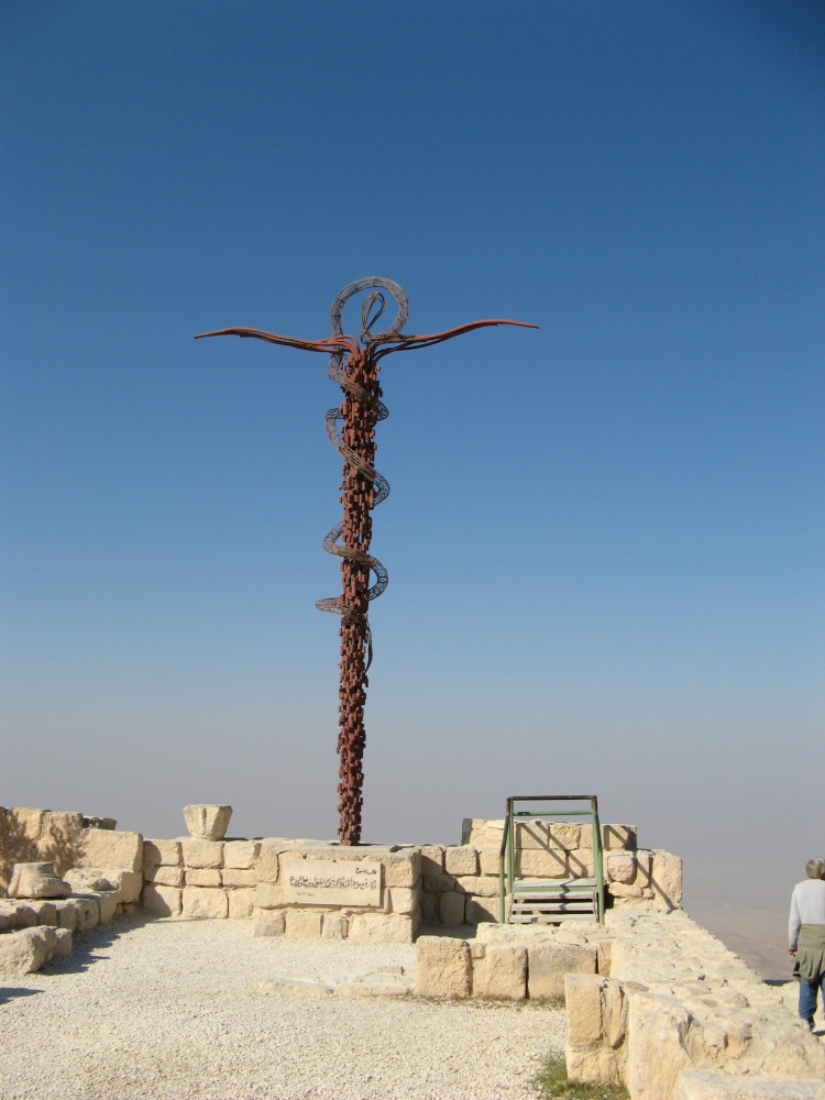 Brazen Serpent sculpture on top of Mount Neto by Italian artist Giovanni Fantoni showing twisting form of the Brazen Serpent winding around a cross-like staff