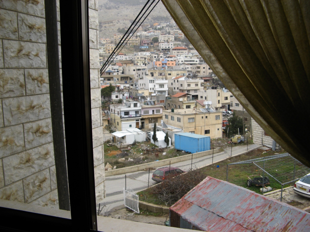 View out of window to town in northern Golan Heights near Syria and Lebanon.