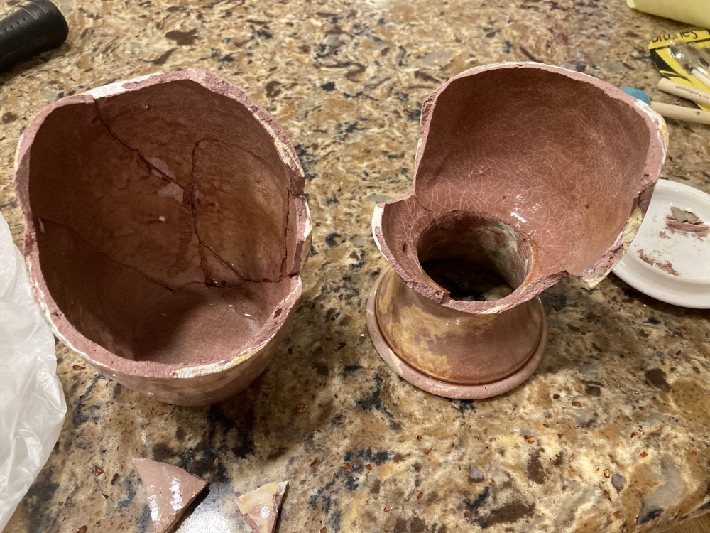 Two portions of the broken vase are shown side by side as pieces are being glued on each.