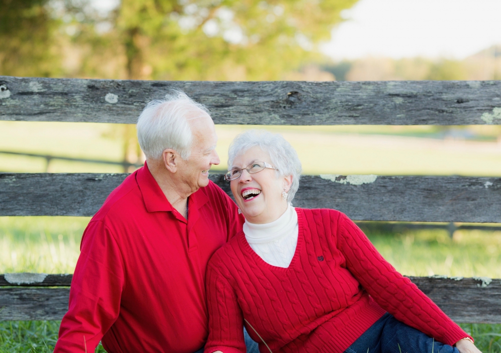 White haired Monty and Phyllis Kester enjoying each other in outdoor scene.