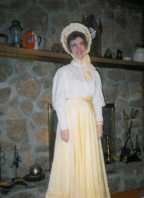 Phyllis Smith Kester dressed in a yellow bonnet to match her long yellow skirt after attending an 